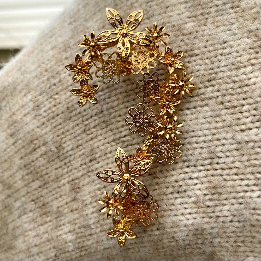 Gold colored ear piece